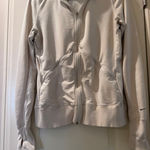 Nike Women's  zip up size large Photo 0