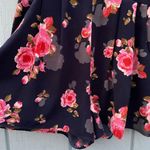 Navy floral romper with pleated pockets Photo 1