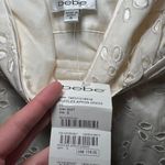 Bebe NWT Cotton Eyelet Embroidered Sleeveless White Ruffles Apron Dress Size Small Photo 2