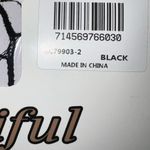 Awesome black fishnet stockings with skull design. Photo 3