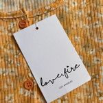 Love, Fire NWT  cropped cardigan and tank set in orange sherbet with ditsy print. Photo 8