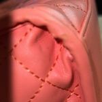 Betsey Johnson Chic salmon colored Quilted Handbag with cross body strap. Photo 11