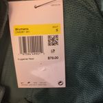 Nike  green standard fit golf shorts size small Photo 3