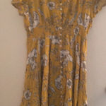 Flower print dress with smocking at the waist. This XL size dress is 100% rayon. Gold Photo 1