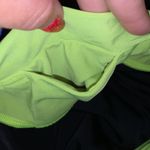 Under Armour  black capri neon green athletic leggings Photo 5