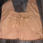 Zenana Burnt orange sweatpants- Soft inside material.  Some spots bleached  Photo 1