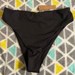 SKIMS mid waist swim bottoms Photo 0