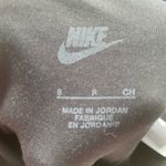 Nike women’s black leggings, white swoosh logo on bottom ankle; size S Photo 5