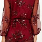 Showpo What Comes Around Playsuit in Wine Sequin Photo 1