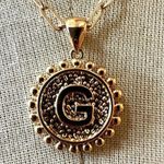 Gold tone G monogram pendant necklace Photo 1