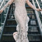 Allure Bridal  Wedding Dress Style; F239 Andi Was altered to fit me at 5’2. The dress does have a few small tears in the train which are pictured. A bustle was added to the dress the train can be tied up. Any extra fabric from being altered was also saved. Photo 2