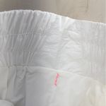 Free People nwt MOVEMENT the way home smocked shorts workout white M travel Photo 2