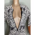 Free People New. WET brown zebra surf suit. Retails $198 Photo 3