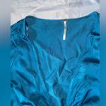 Free People  miraya turquoise front twist satin long sleeve crop top Photo 1