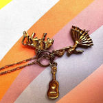 Gold tone flamenco dancer, bull, guitar charm necklace Photo 2