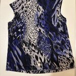 Kasper Beautiful  petite sleeveless blouse in a striking blue, black, gray, and white animal-print pattern. Photo 1