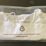 Ecoparty NWT--WHITE SPORTS BRA-SIZE 2X Quick drying, moisture wicking, 88% polyamide. 12% elastane, lightweight, anti wrinkle, anti roll up, anti shrinking, brand new in package  Measurements: Bust: armpit to armpit 19-22 inches  Length: shoulder seam to bottom 17 inches Photo 4