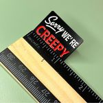 Boutique Black and Red Sorry We're Creepy Sign Style Enamel Pin NWOT Photo 3