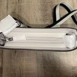 NWT Michael Kors Jet Set Medium Swing Pack Webbed Crossbody Strap color Aluminum White Photo 1