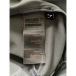 Gymshark  Gray Black Colorblock Asymmetrical Leggings Side Pockets Stretch Sz XS Photo 5