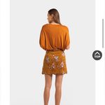 Francesca's Francesca’s Burnt orange/brown floral skirt Photo 1