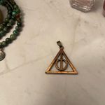 Harry Potter Deathly Hallows Spinning Pendant Bronze Toned Brown Photo 3