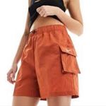 Nike  loose fit high rise cargo shorts orange rust women’s size small new‎ casual Photo 2