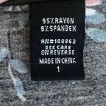 Torrid -BLACK WITH PINK FLOWERS BABYDOLL TOP-WOMENS SIZE 1X Black babydoll top, light and dark pink flowers, short sleeves, button front, lots of stretch, 95% rayon and 5% spandex, excellent condition Measurements: Bust: armpit to armpit 24 inches Length: shoulder seam to bottom Front: 29 inches Back: 32 inches Photo 6