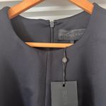 Kendall + Kylie NWT  Black Sleeveless Top with laser cutout at hem. Photo 4