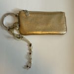 NY&CO GOLD WRISTLET WITH 3 RINGS AS WRISTLET HAS RIBBON DEATTACHABLE ADORNMENT Photo 0