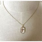 Gold tone and opal T monogram pendant necklace Photo 1