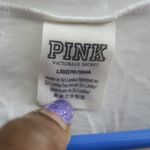 PINK Victoria's Secret tie up lace neckline pink on sleeves short sleeve shirt in white and black size large. Photo 8