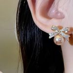 Delicate Bow With Imitation Pearl Design Stud Earrings Photo 1