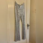 Hera Collection  Silver Sequin Flare Jumpsuit Photo 1