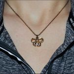 Gold bedazzled bow necklace Photo 0