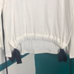 Jessica Simpson Off white light sweater with black ribbon … Photo 1