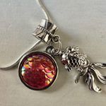 Silver tone fish pink disc charm necklace Photo 2