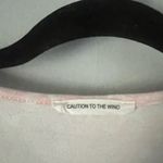 Caution to the Wind  Pink top with white stars Ruffle sleeves size large Photo 2