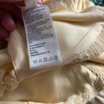 Urban Outfitters yellow feminine tank top Photo 3