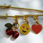 Gold Safety Pin with Charms Photo 0
