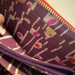 Pylones large "Voyage" wallet with a white flower/orchid pattern red Background Photo 6