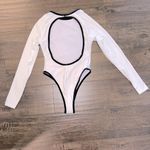 NWOT Long Sleeve Open Back One Piece Photo 2