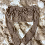 Off shoulder long sleeve cropped top. Tan Photo 1