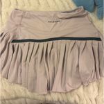 Gold Hinge  pink skirt  Photo 0