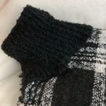 Me Too Black/White Ponco with fringe on edges and solid black cow neck. Photo 2