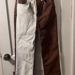 Top Shop Jeans that are a brown and off white color size women’s 28! Photo 0