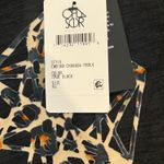 Chaser  Black T-Shirt with Abstract Heart Design Photo 1