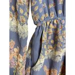 The Hanger  Floral Romper Size Medium Baby Blue Long Sleeve Pockets Floral Shorts Photo 2