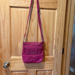 Travelon Anti-Theft Classic Mini Shoulder Bag in the Berry Tulip color Photo 1