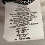 Chic Black and Ivory Jumpsuit with Bow Detail Photo 2